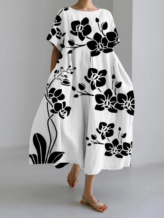 AVA – Elegant Svart Blommig Klänning